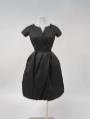 Image of Woman's black alpaca wool cocktail dress with underskirt, 1956